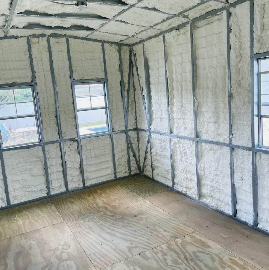 Closed-cell spray foam insulation applied to wall cavities in a residential project in Guilderland